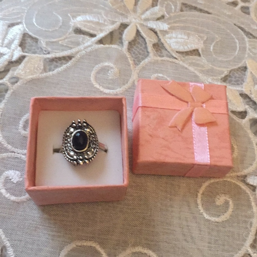 Sliver color ring with black oval center stone